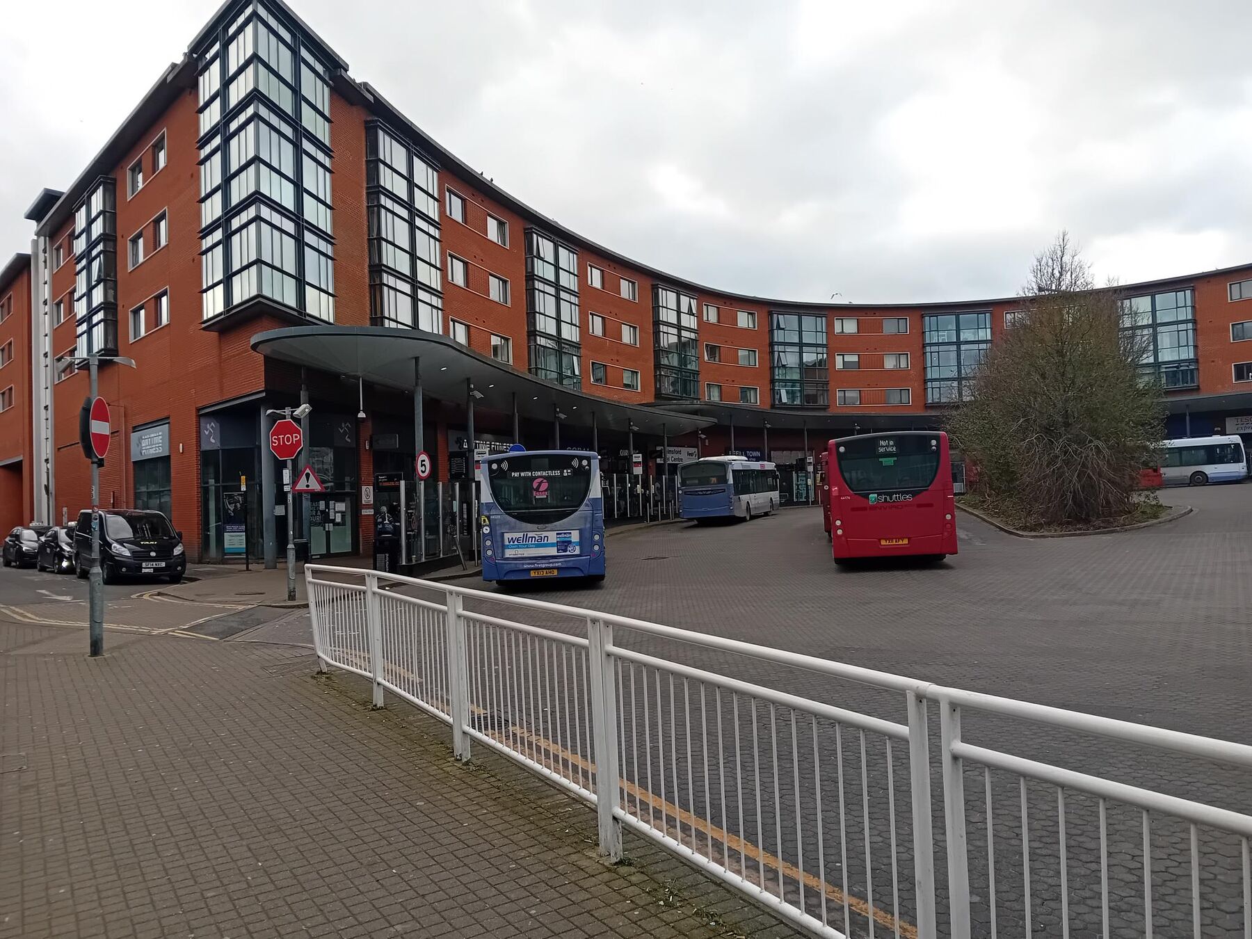Curved passenger canopy and buses at Chelmsford Bus Station